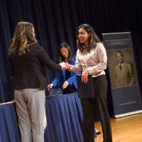 Emily shaking hands with Anamika